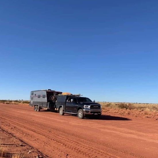 Great Escape Caravan with Car on red dust road